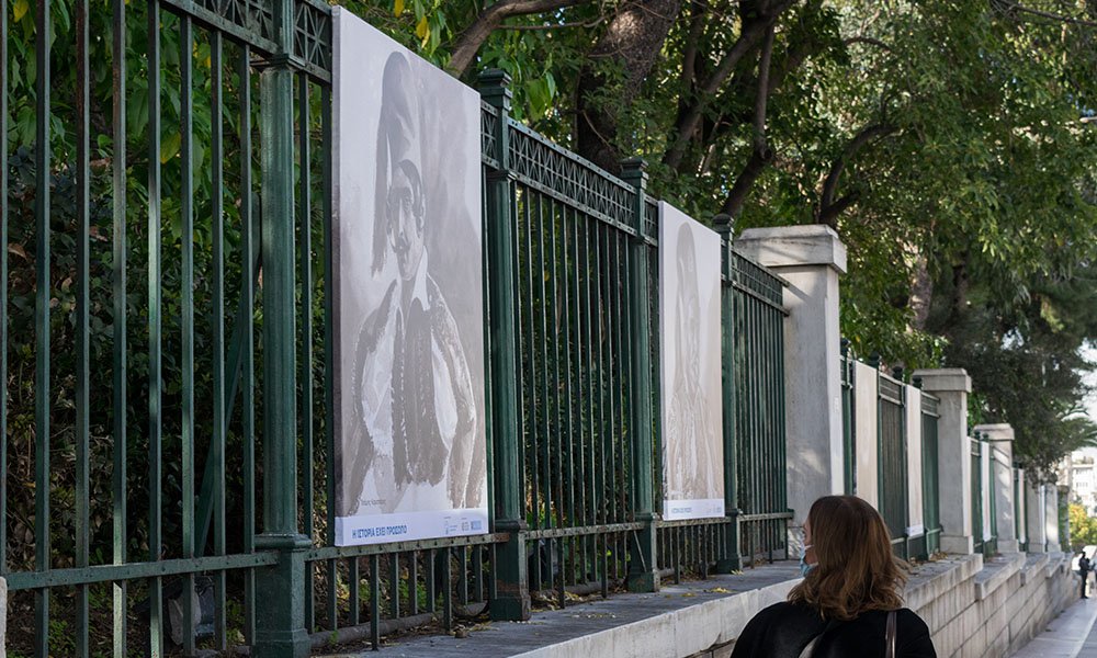View of the outdoor exhibition. The portraits depict Tsamis Karatasos (left) and Vasileios Pet[i]mezas (right).